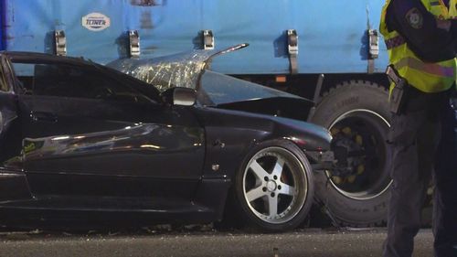 A man has been charged after a woman died in a crash in Sydney's south-west on Friday night. Emergency services were called to Broadhurst Road in Ingleburn after reports a sedan crashed into a truck parked near the intersection of Shaw Road.