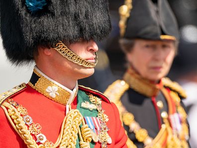 LONDON, ENGLAND - JUNE 02: Prince William (L), Duke of Cambridge, in his role as Colonel of the Irish Guards, and Princess Anne (R), Princess Royal, in her role as Colonel of the Blues and Royals, ride their horses along The Mall during Trooping The Colour on June 2, 2022 in London, England.Trooping The Colour, also known as The Queen's Birthday Parade, is a military ceremony performed by regiments of the British Army that has taken place since the mid-17th century. It marks the official birthda