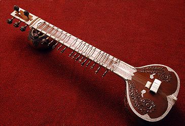 How many of the 18 to 21 strings on a sitar are ordinarily plucked to produce the melody?