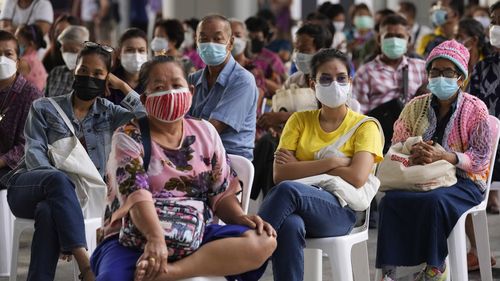 Thailand tightens measures as daily cases cross 10,000