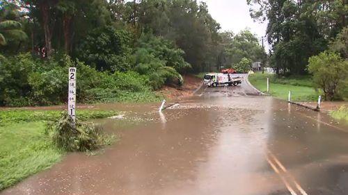 Flooding has forced the closure of Hardys Road, Mudgeeraba.(9NEWS)