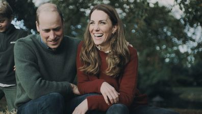 Prince William and Kate Middleton sit together with their kids by the open fire, as the Duchess fiddles with her famous sapphire and diamond engagement ring