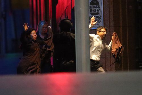 Lindt cafe hostages flee after the siege.