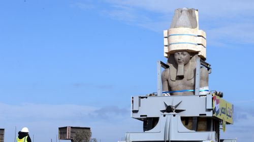 A view of the giant granite statue of the ancient Egyptian Pharaoh Ramses II loaded onto a truck and transferred to its permanent display area at the Atrium of the Grand Egyptian Museum. (AAP)