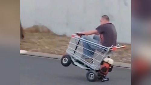 Sitting in the trolley, he revs the engine before pushing it onto its rear wheels. (Lisa Burgess)