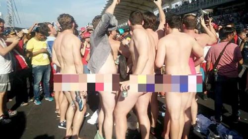 A censored photograph shows some of the men who stripped to their briefs in front of crowds in Malaysia. (The Star)