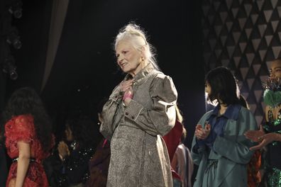 Vivienne Westwood accepts applause after the conclusion of her Ready To Wear Fall/Winter 2022-2023 fashion collection, unveiled during the Fashion Week in Paris, Saturday, March 5, 2022. (Photo by Vianney Le Caer/Invision/AP)
