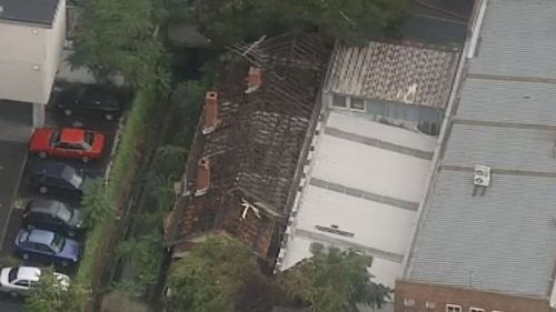 Two timber sheds and a house have gone up in flames. (9NEWS)