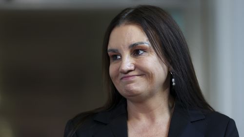 Senator Jacqui Lambie speaks to the media at Parliament House in Canberra on May 13, 2024.