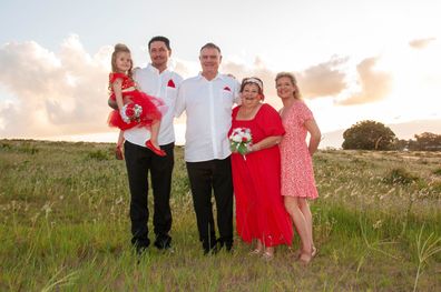 Bob Crothers and Anette Young surrounded by family after tying the knot.