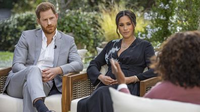 This image provided by Harpo Productions shows Prince Harry, from left, and Meghan, The Duchess of Sussex, in conversation with Oprah Winfrey. (Joe Pugliese/Harpo Productions via AP)