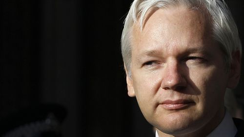 WikiLeaks founder Julian Assange pauses as he makes a statement to media gathered outside the High Court in London on Monday, December 5, 2011.