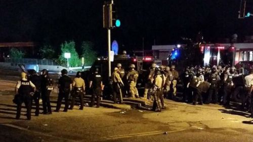 Riot police establish a line across a street in Ferguson. (Source: Twitter, @thetechCEO)