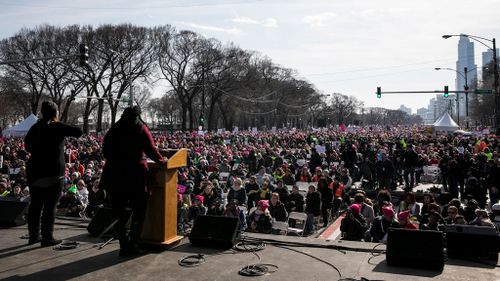 Quiana McKenzie, the regional campaign finance advisor for Emily's List, speaks on stage during a rally in Grant Park before a Women's March in Chicago. (AP)