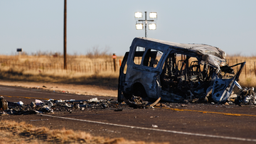 The damage bus sits on the side of the road at the scene of a fatal car wreck early Wednesday, March 16, 2022 just north of State Highway 115 on Farm-to-Market Road 1788 in Andrews County, Texas. 