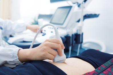 Woman undergoing ultrasound exam
