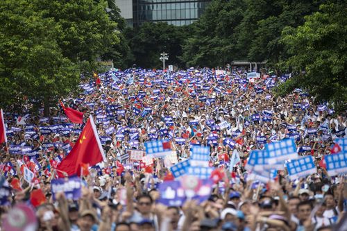 Tens of thousands of demonstrators gather outside of the Hong Kong government headquarters complex to show their support to the police as they fought largely against young demonstrators opposed to a now postponed plan to allow extraditions to mainland China. 