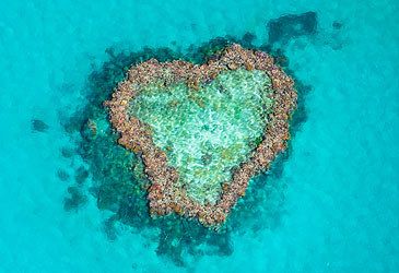 The Great Barrier Reef's Heart Reef is situated amid what group of islands?