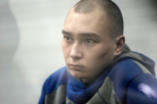 Captured Russian soldier, Sgt. Vadim Shishimarin, 21, attends a court hearing on May 18, 2022 in Kyiv, Ukraine. Sgt. Shishimarin pleaded guilty to shooting a civilian on a bicycle in the village of Chupakhivka, Sumy Region, days after Russia's invasion of Ukraine on Feb. 24. The trial of the Russian soldier was the first that Ukraine has conducted since the invasion related to charges that could be considered war crimes. 