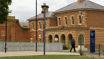A Corrections Officer walks past the Goulburn Correctional Centre in Goulburn. The High Risk Management Correctional Centre which is part of the Goulburn Correctional Centre has undergone a refurbishment. Goulburn, NSW. 22nd November, 2021. Photo: Kate Geraghty