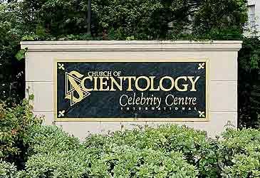 Which term denotes the immortal beings that Scientologists believe inhabit humans?