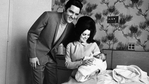 The couple with their daughter Lisa Marie Presley. (AAP)