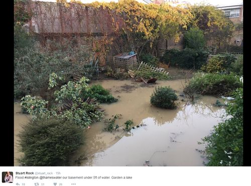 Stuart Rock's backgarden in ruins after burst water mains flooded Islington, north London.