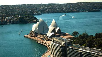 Sun strikes the world famous Sydney&#x27;s Opera House.