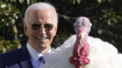 President Joe Biden speaks after pardoning the national Thanksgiving turkey, Peach, during a ceremony on the South Lawn of the White House in Washington, Monday, Nov. 25, 2024. (AP Photo/Mark Schiefelbein)