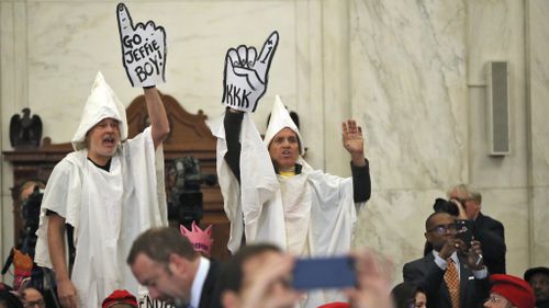 Protesters dressed as KKK disrupt confirmation hearing for new US attorney general