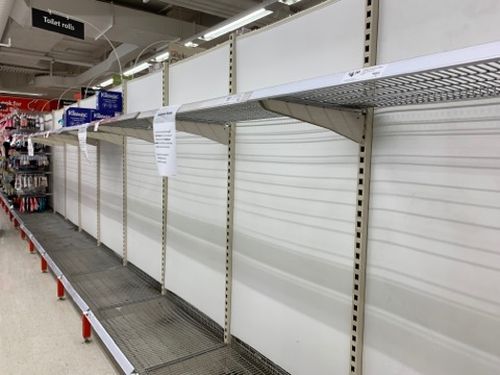 Empty shelves pictured at a Coles store as toilet paper shortages continue.