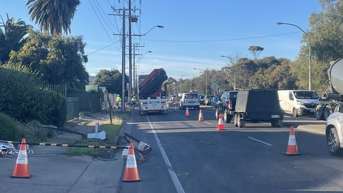A ute collided with a Stobie pole, brought down power lines and hit a water meter. 