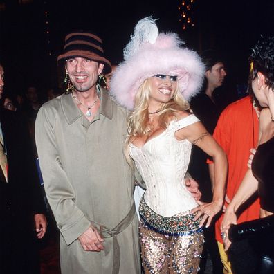 Pamela Anderson poses for a picture with husband Tommy Lee on September 9, 1999 at the MTV Video Music Awards in New York City. Anderson got her start as a Playboy Playmate before moving on to Labatt's commercials, a part in Home Improvement, before starring in Baywatch. 