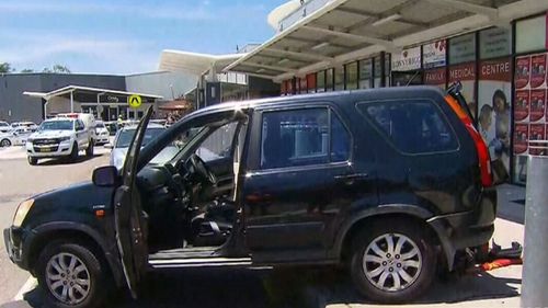 The driver, thought to be in his 70s, was allegedly backing out of a carpark at Bonnyrigg Plaza. (9NEWS)