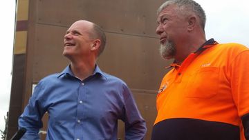 Queensland Premier Campbell Newman inspects trucks while campaigning. (AAP)