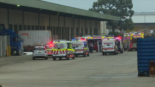 A man has been killed at a warehouse in Sydney's south-west after a car crashed into a stationary trailer.