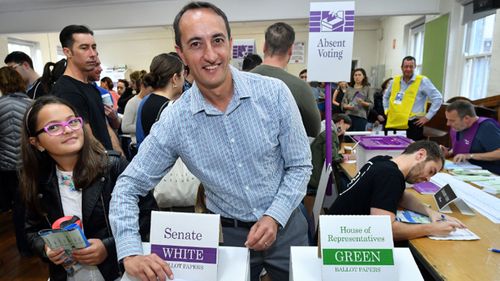 Dave Sharma casts his vote as he fights for the seat of Wentworth.