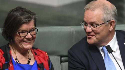 Australian Prime Minister Scott Morrison speaks to Independent MP Cathy McGowan during division in the House of Representatives at Parliament House in Canberra. 