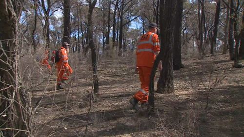 Police and SES scoured bushland for the Melbourne woman's body yesterday. (9NEWS)