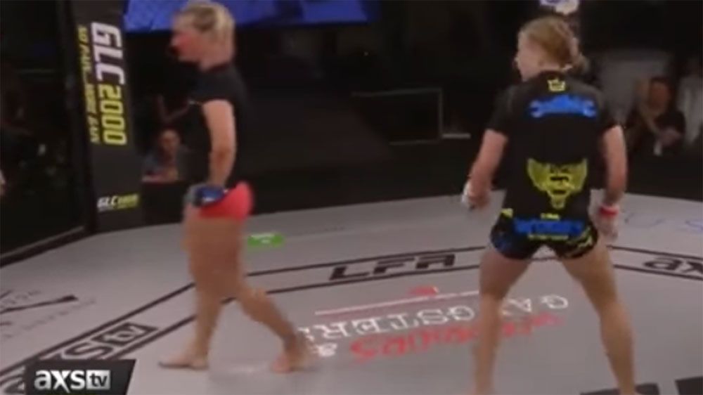 MMA fighter cops more punches after mistakenly walking back to her corner