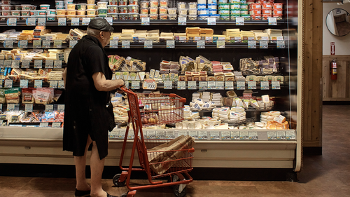 A man shops at a supermarket on Wednesday, July 27, 2022, in New York. Higher mortgage rates have sent home sales tumbling. 