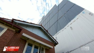 The eyesore seven storey 'mega wall' dwarfing elderly couple's house