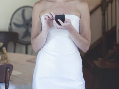 Bride sending text messages ahead of wedding