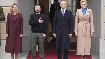 Poland&#x27;s President Andrzej Duda, 2nd right, with his wife Agata Kornhauser-Duda welcomes Ukrainian President Volodymyr Zelenskyy with his wife Olena, left, as they meet at the Presidential Palace in Warsaw, Poland, Wednesday, April 5, 2023. 