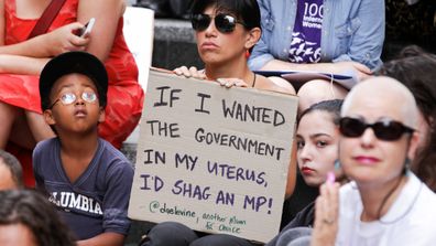 A woman holds a sign at a pro-choice rally in Sydney. (AAP)