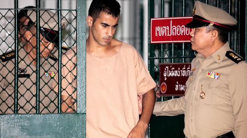 Soccer player with Australian refugee status Hakeem Al-Araibi is escorted to his court hearing by Thai prison officers.