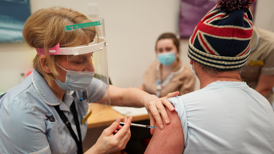 Key Worker Mark Reid from North Shields receives the Pfizer BioNTech Covid-19 vaccine at a mass vaccination hub at the Centre For Life in Newcastle on January 09, 2021 in Newcastle upon Tyne, England. 