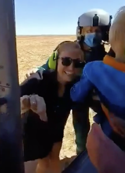 Relief was evident on Lindsey's face as she stepped onto the helicopter with her son.