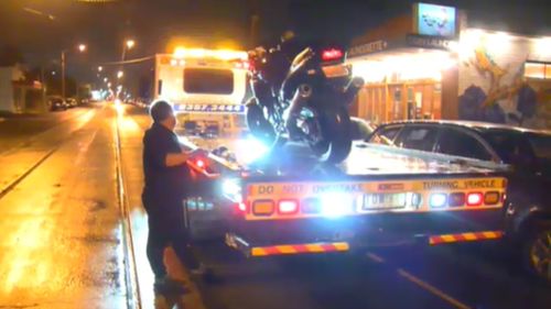 The allegedly stolen motorcycle was towed from the scene. (9NEWS)