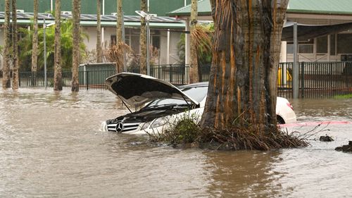 A car is inundated by floodwater in Lismore, NSW.